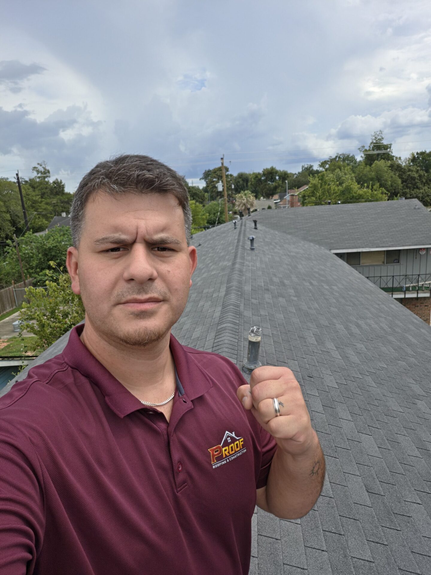 Cody, owner of PROOF Roofing, on a roof in Fort Bend County